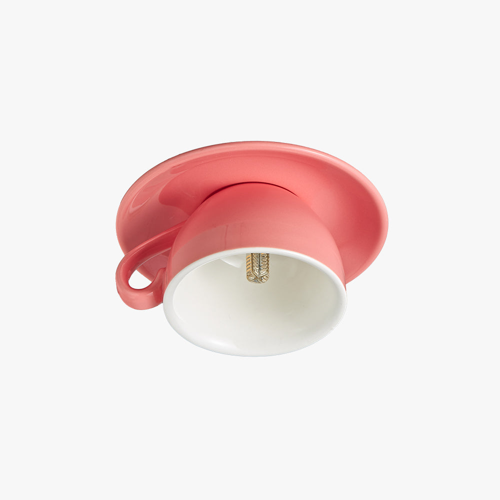 Pink novelty teacup flush mount kupce ceiling light isolated on a light grey background