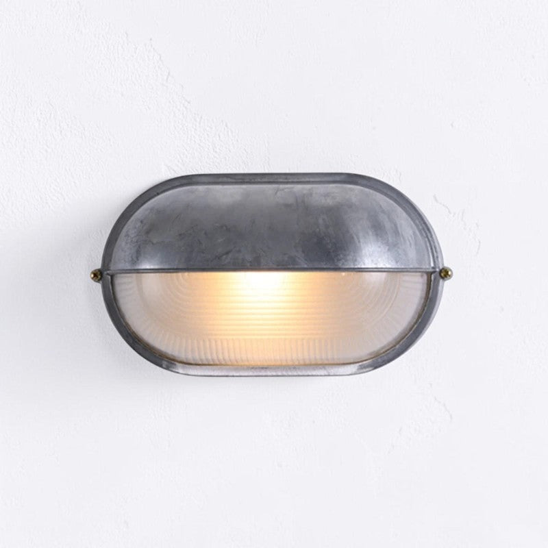 Kuxqa die-cast aluminium bulkhead wall light, illuminated, mounted on a white wall