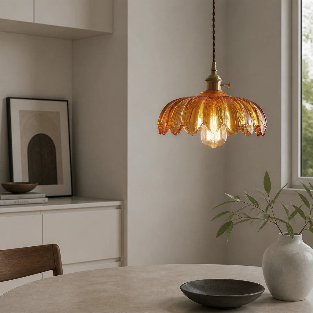 Kyler amber ribbed glass pendant light hanging above a dining table near a kitchen sideboard