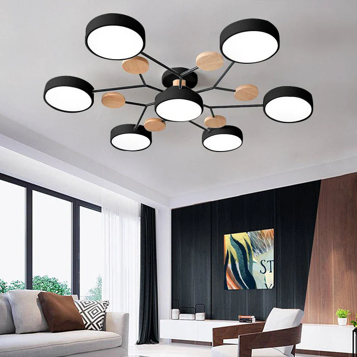 Black 7-light multi-arm lasve chandelier creating a dramatic architectural statement in a dark living room