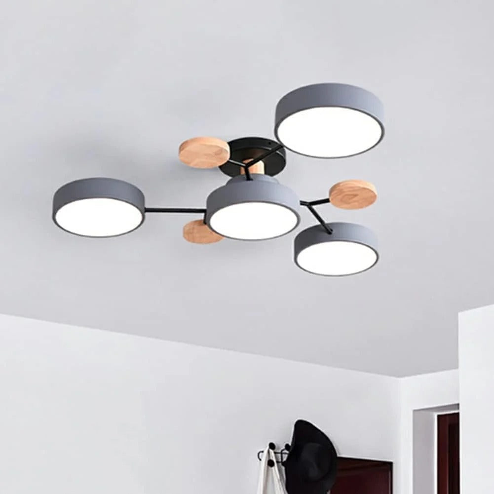 Isolated view of the compact grey lasve 4-light geometric branch chandelier