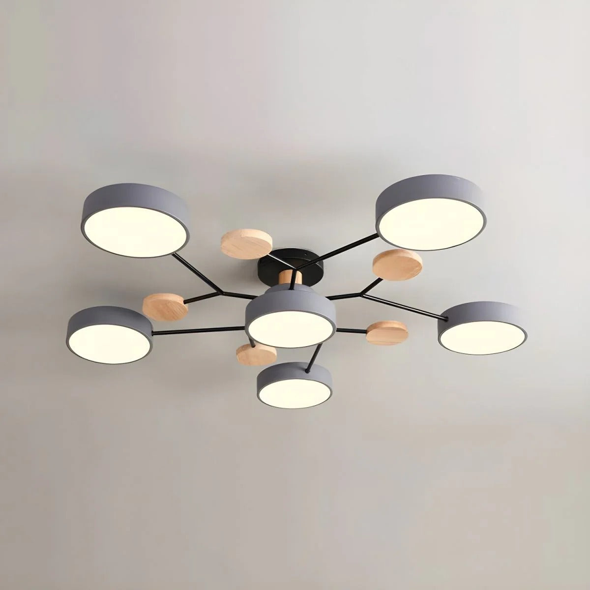 Sophisticated grey lasve 6-light modern semi-flush mount ceiling light isolated against a light ceiling