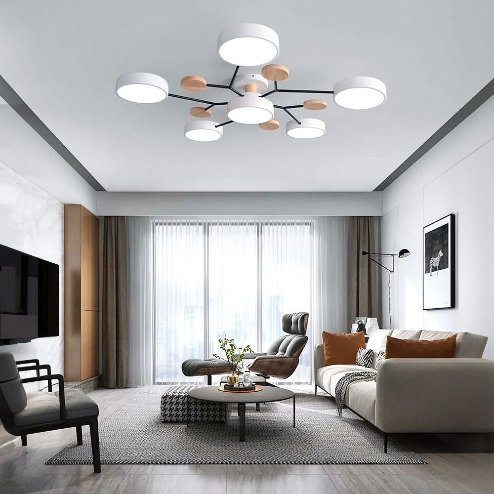Large lasve white 6-light branch LED chandelier acting as the primary light source in a spacious living room