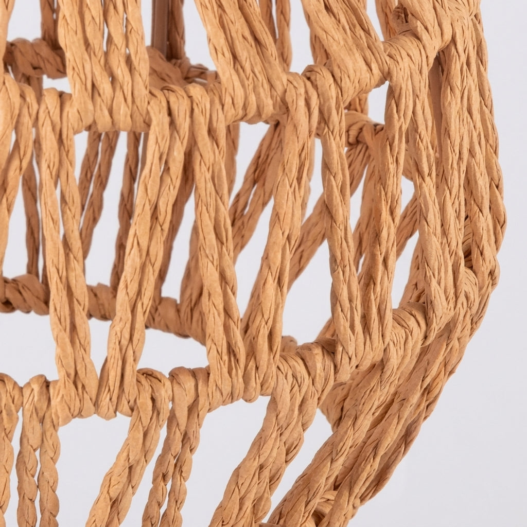Close-up of the hand-woven rattan shade texture on the Limzo wall sconce