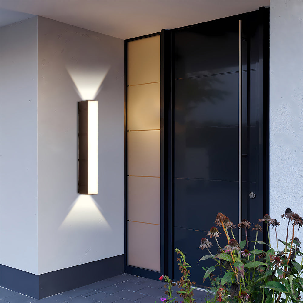 Sleek linear LED porch light installed next to a modern black front door entryway