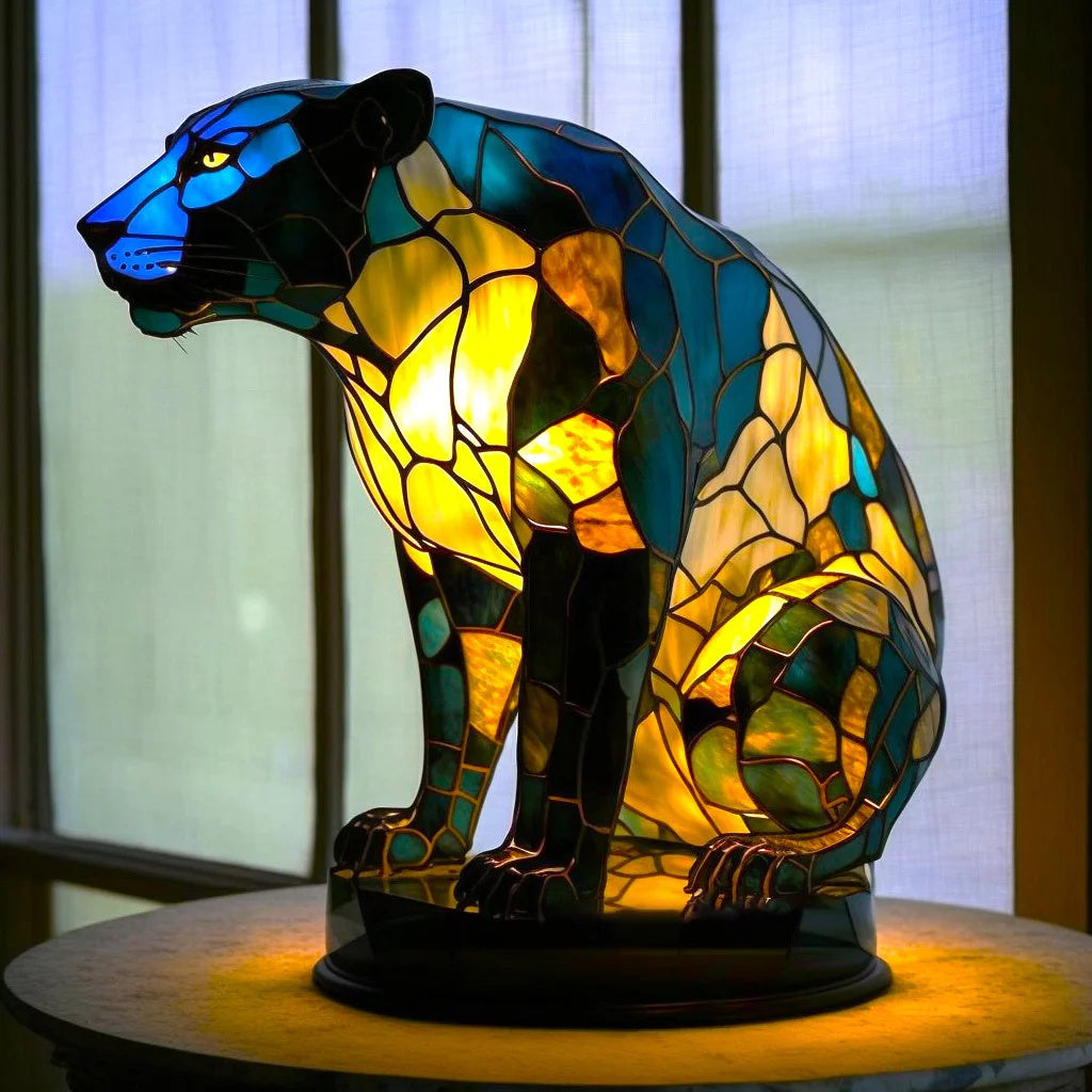 Blue lopi mosaic panther table lamp sitting elegantly as a decorative focal point