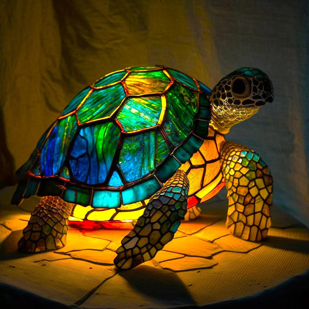 Mosaic lopi sea turtle accent lamp glowing warmly on a dark table surface