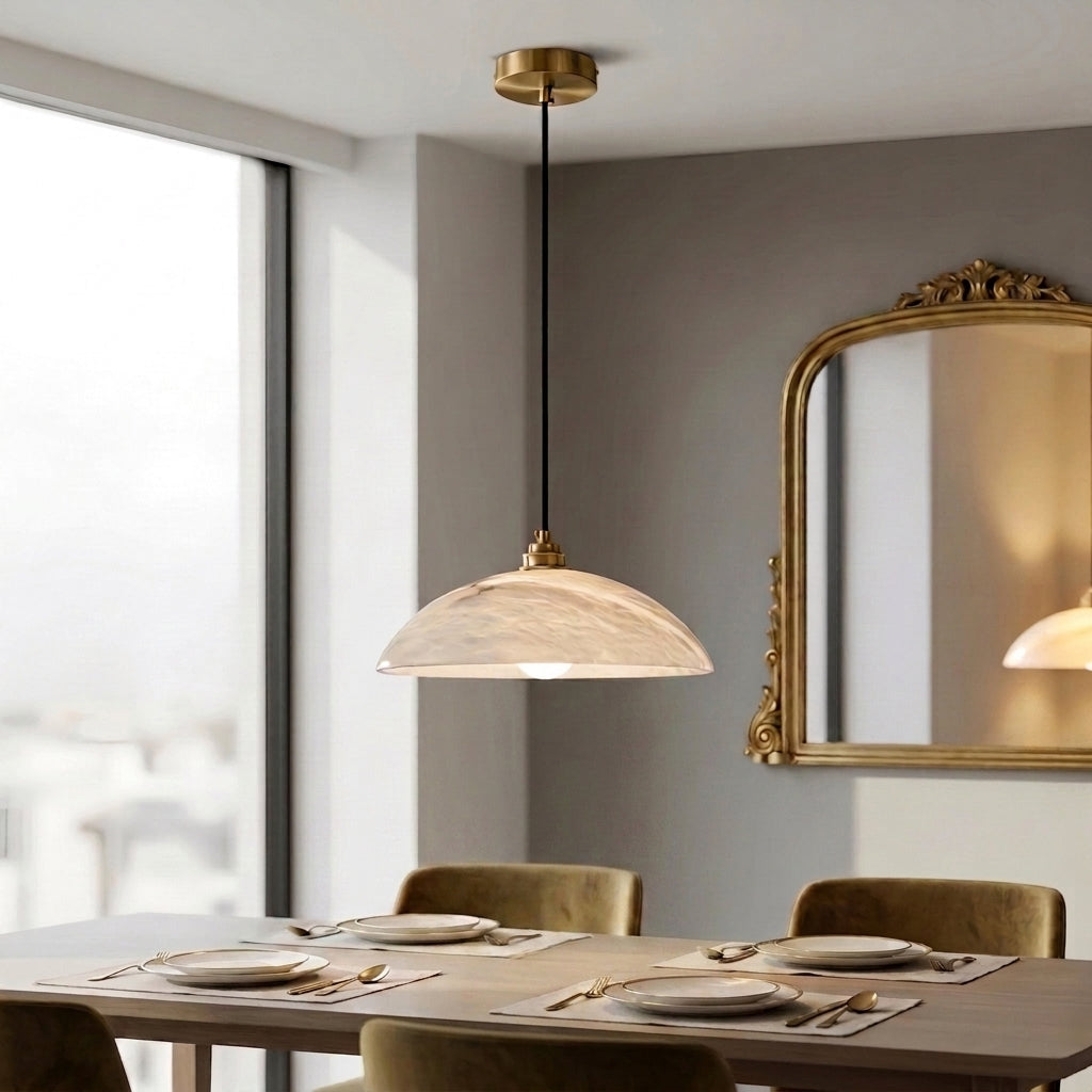 Loxpa marble pendant light hanging above a dining table