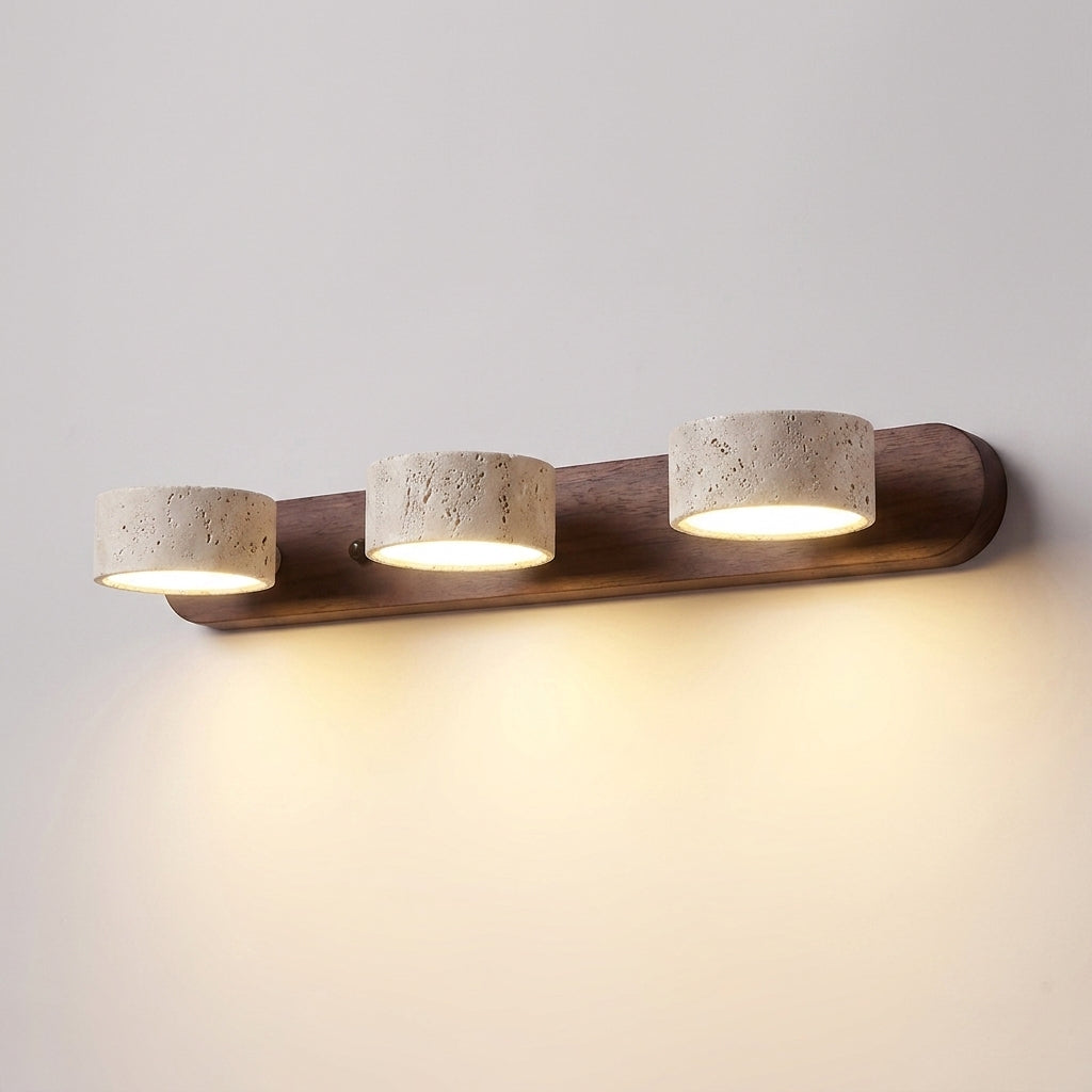 Luvqi 3-head travertine wall light in walnut wood, front view, lit