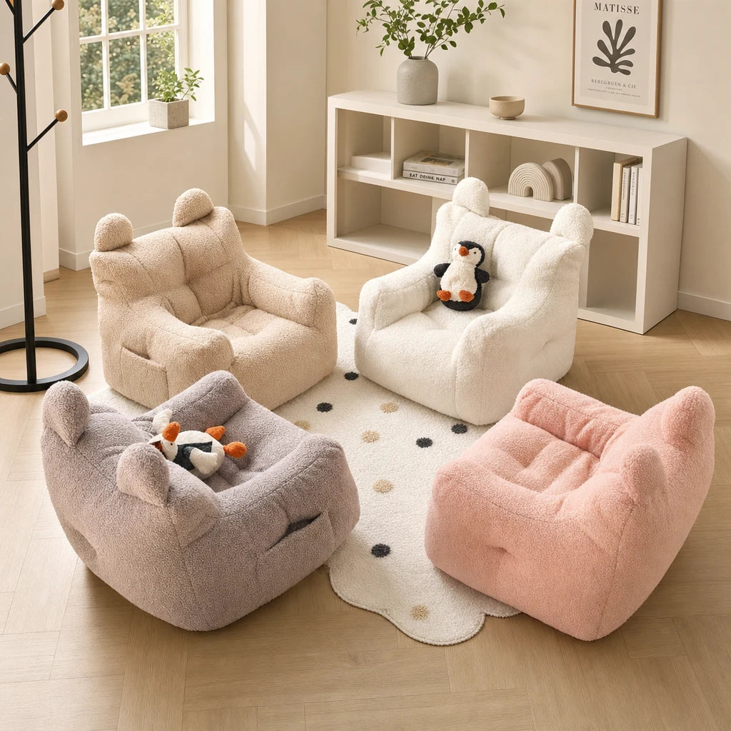 Lydel kids bean bag armchairs shown in four colourways - beige, cream, grey and pink - arranged in a modern minimalist kids room