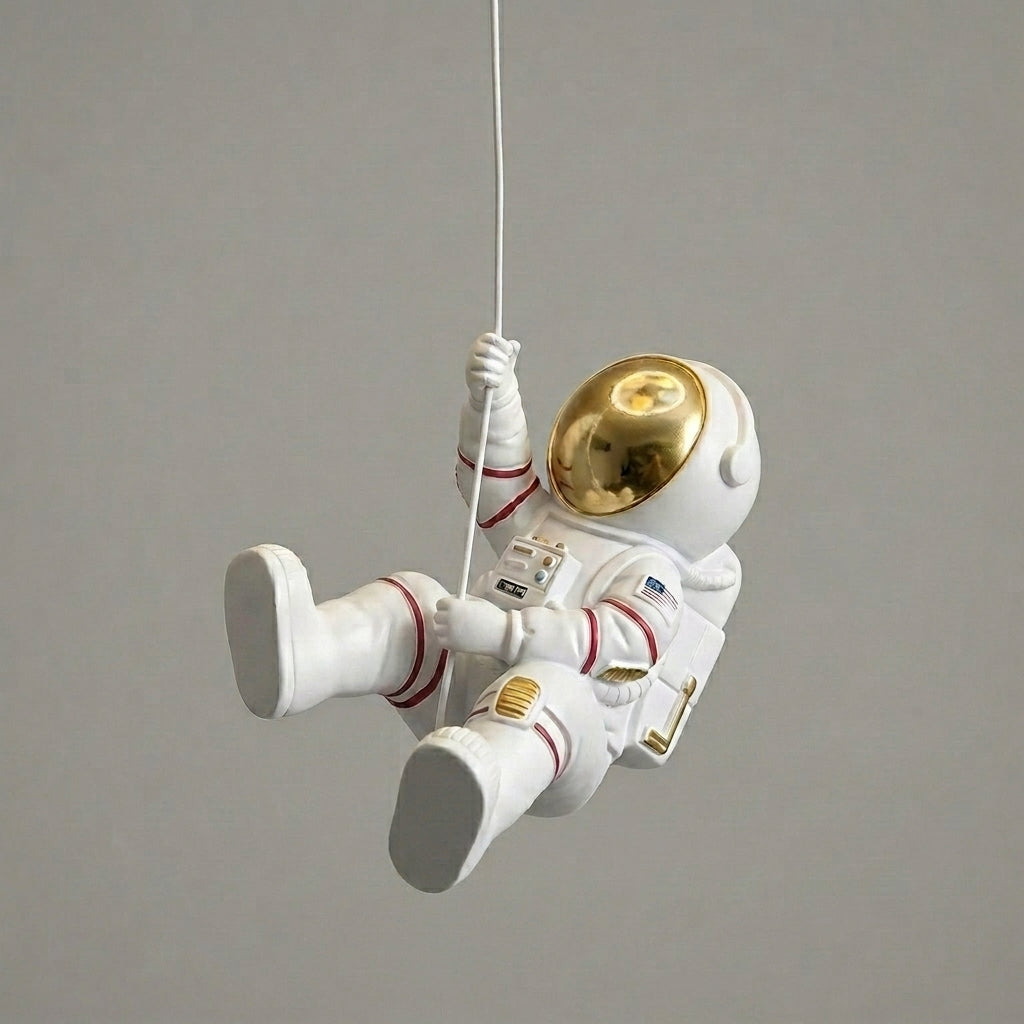 Close-up of the hanging astronaut figure pendant on the Meqzi ceiling light