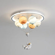 Meqzi astronaut and planet LED ceiling light, hero shot on grey background