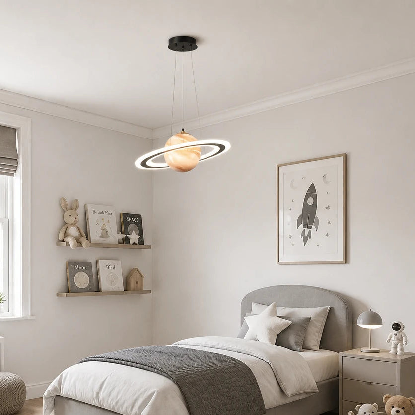 Merven Orange Planet Saturn ring pendant light illuminated during the day in a bright kids bedroom