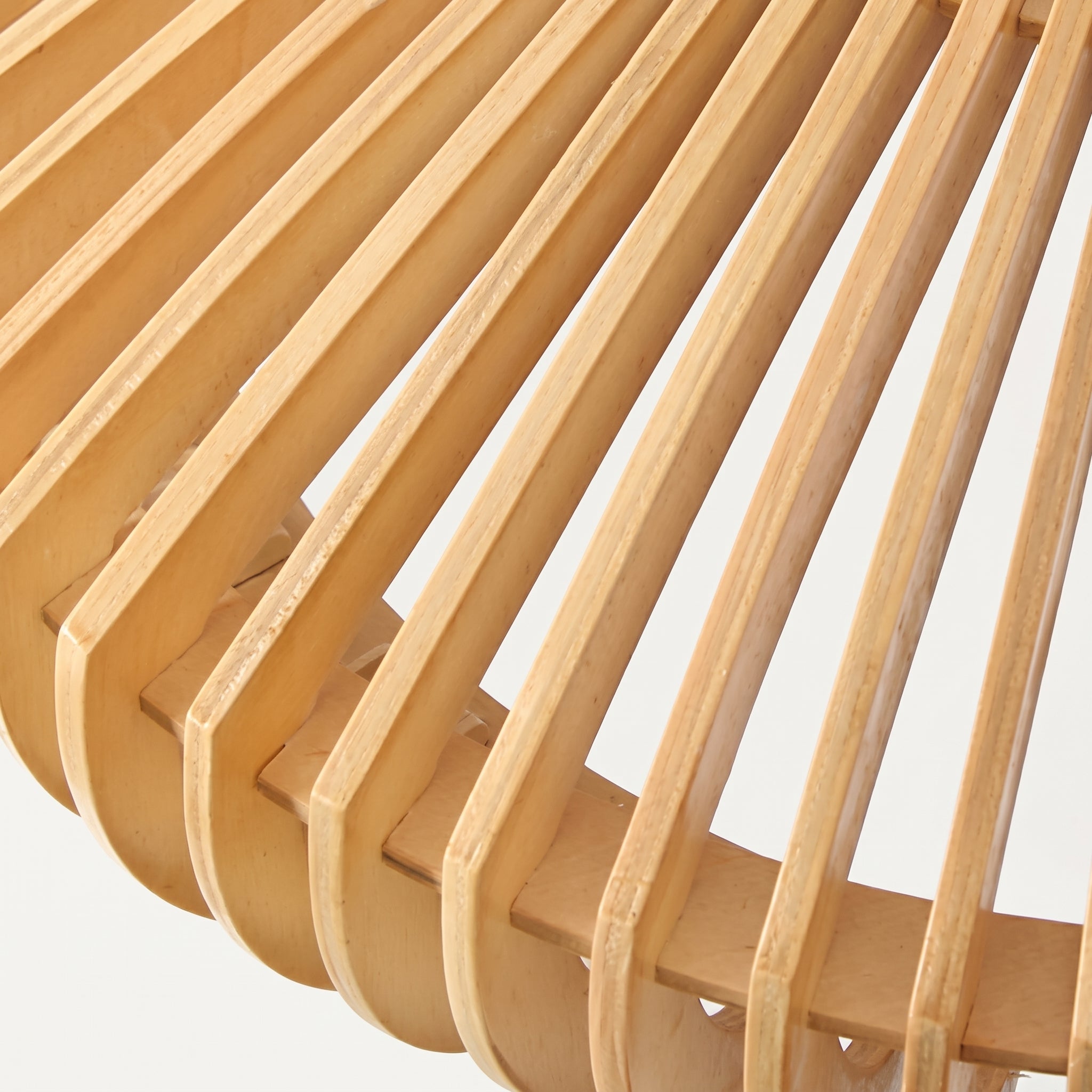 A macro close-up of the curved wooden slats on the mexi Japandi dome ceiling lamp, highlighting the premium natural wood grain and the precisely crafted open ribbed construction