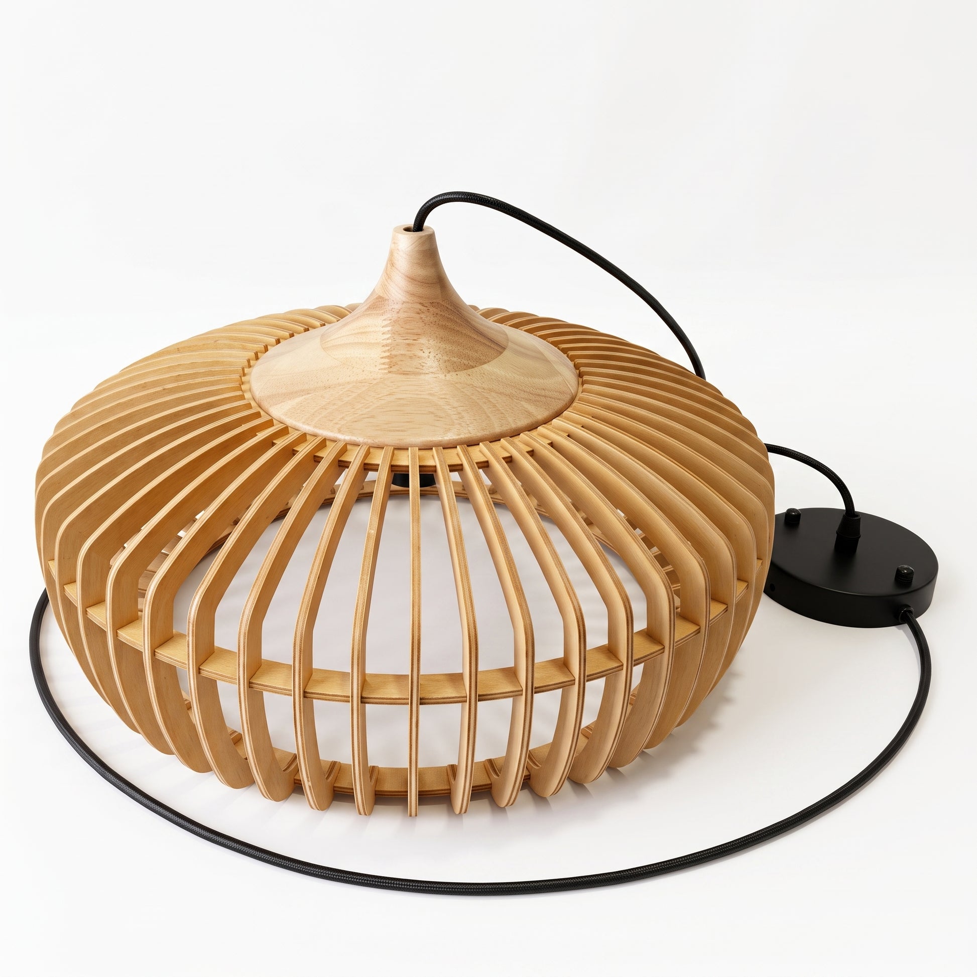 An uninstalled mexi Modern Japandi slatted wood pendant lamp resting on a white surface, showing the 43-centimetre natural wood slatted shade alongside its black ceiling canopy and 120-centimetre adjustable cable