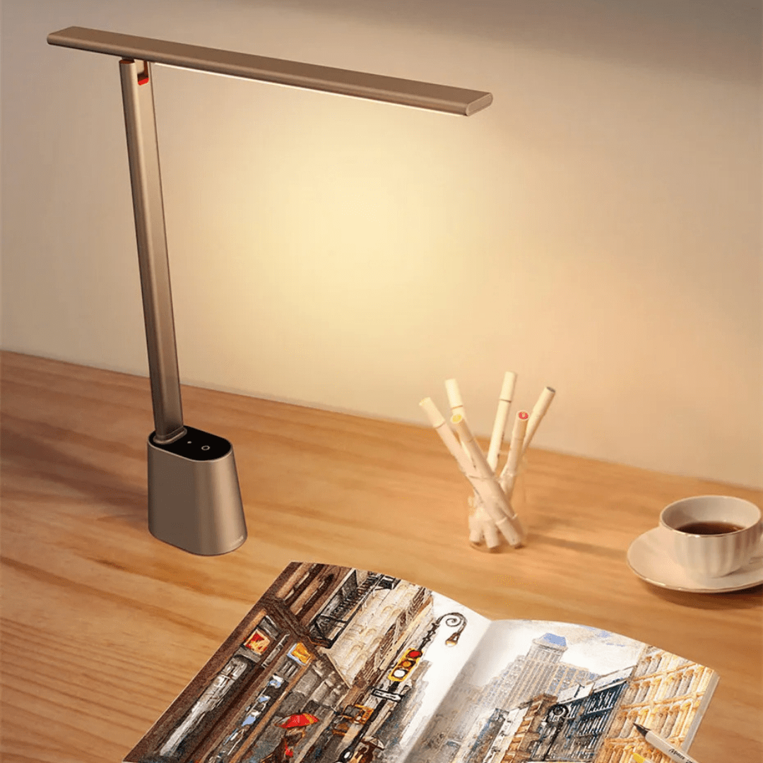 Minimalist aluminium touch reading lamp casting a warm glow on a contemporary home office workspace