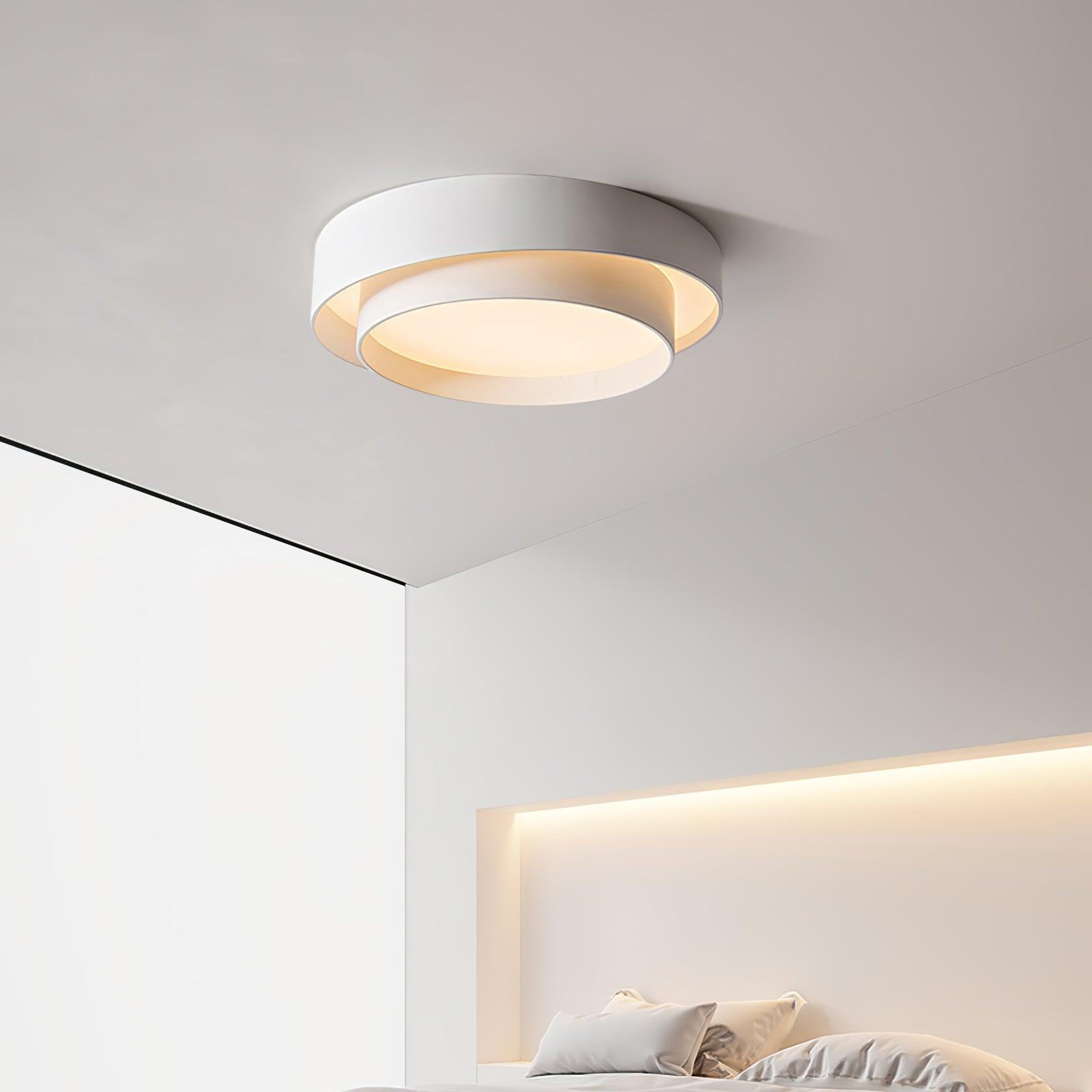 Minimalist white LED ceiling lamp highlighting its sleek, low-profile design in a contemporary bedroom