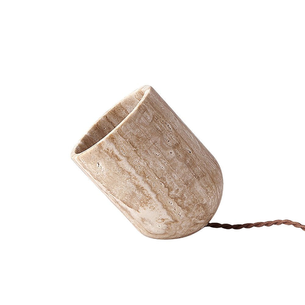 Unlit minimalist yellow travertine lamp showcasing the earthy veining and angled cut of the solid stone