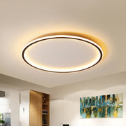 Modern black halo ring LED flush mount ceiling light illuminating a contemporary living space