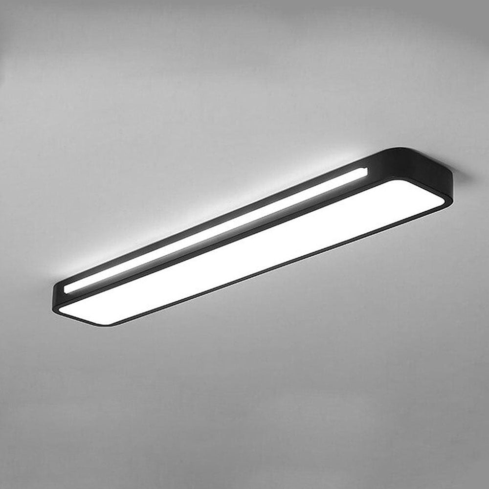 Illuminated modern black LED linear ceiling light showing a bright, even light diffusion