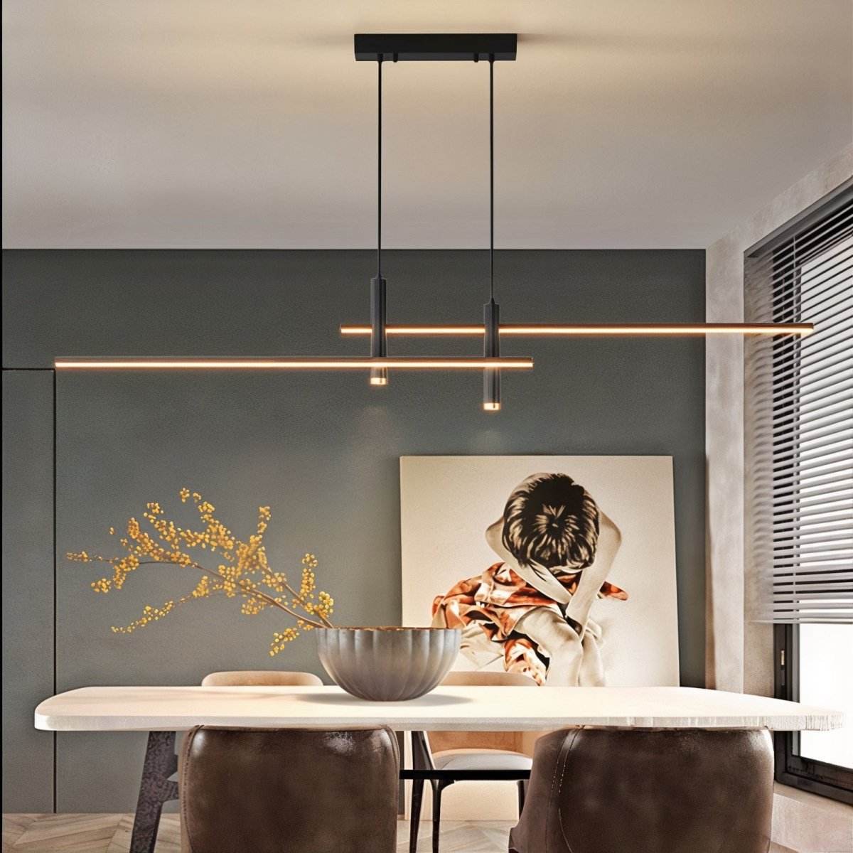 Modern matte black intersecting LED linear pendant light suspended above a contemporary dining table