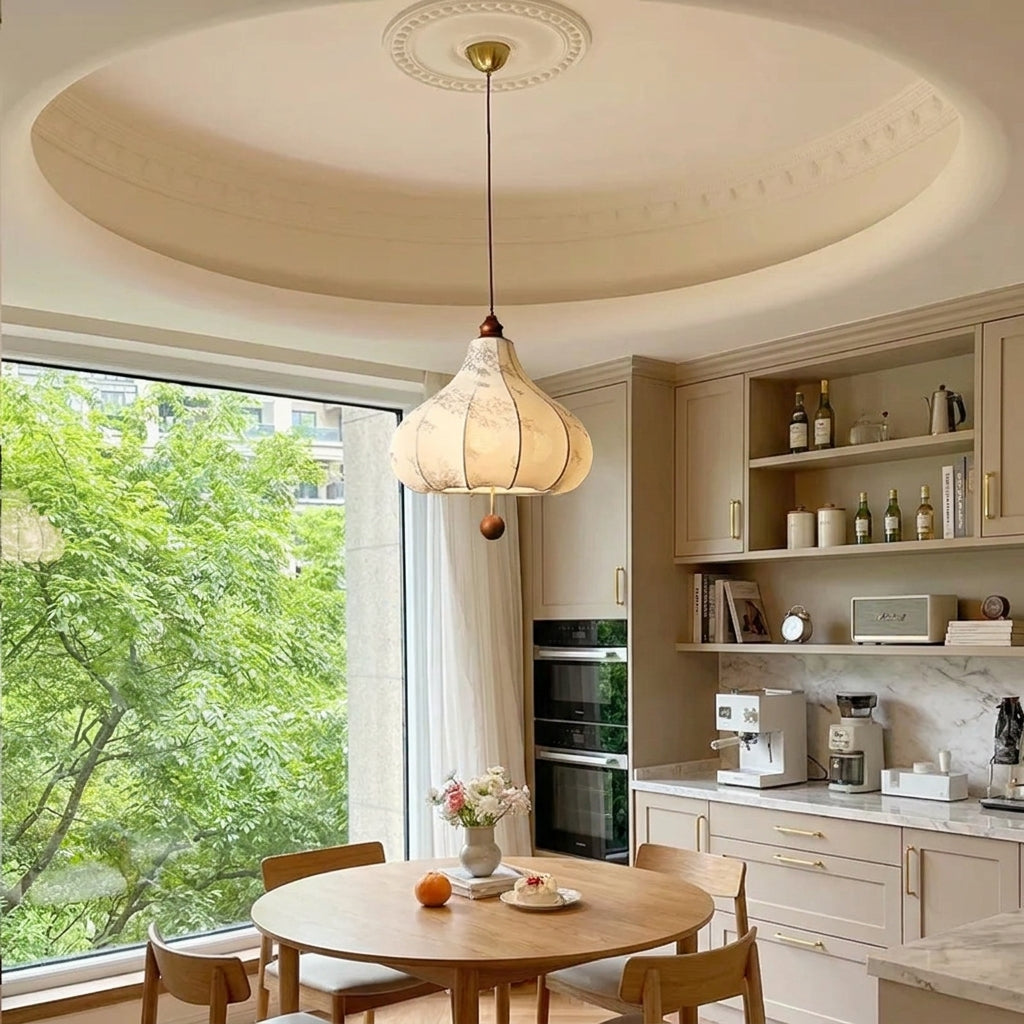 Naxlu pendant light hanging in a kitchen dining nook