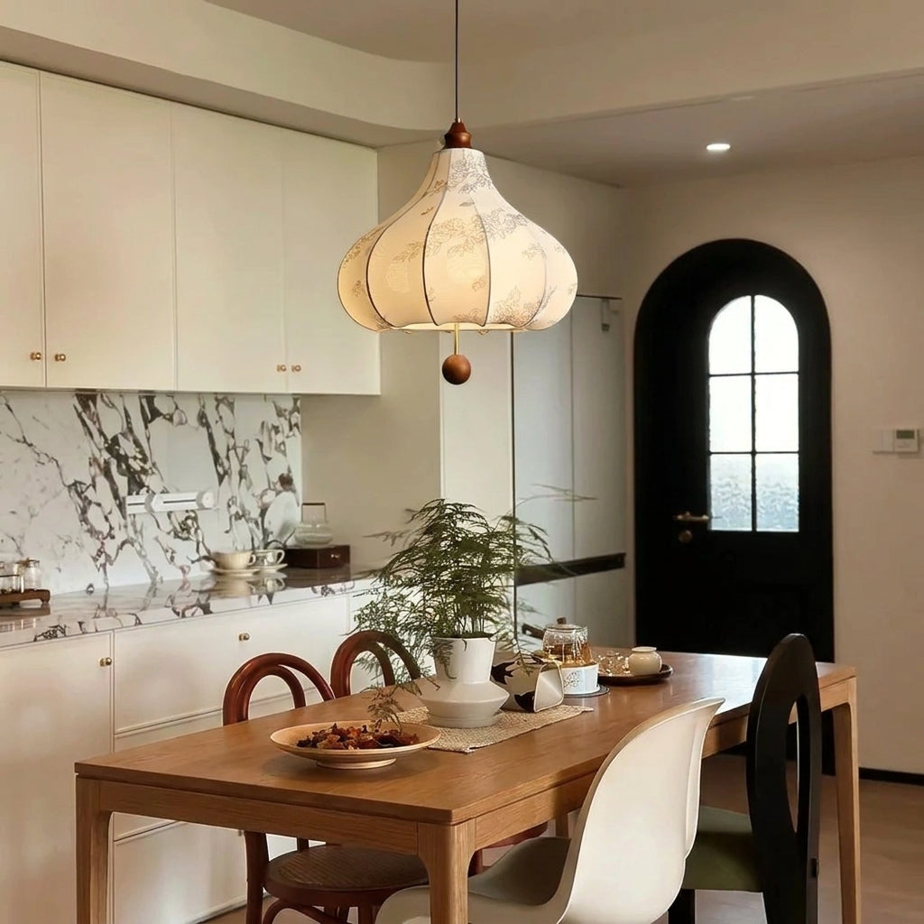 Naxlu pendant light in a kitchen with dark cabinetry
