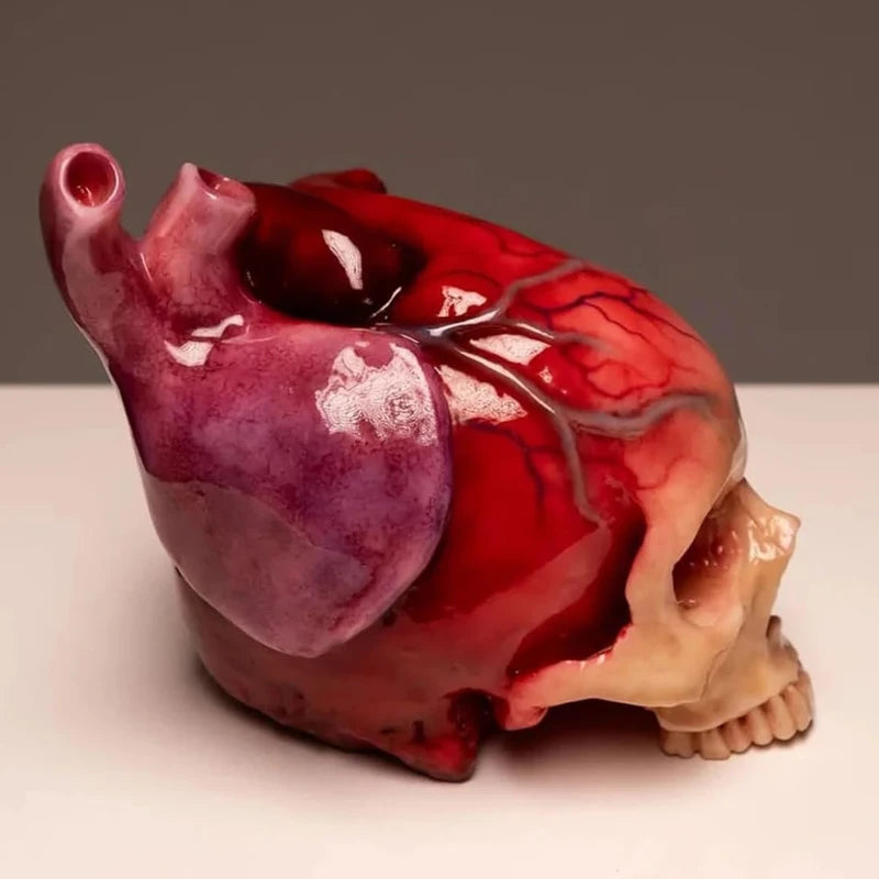 Necrovalve anatomical heart and skull resin ornament, three-quarter angle view