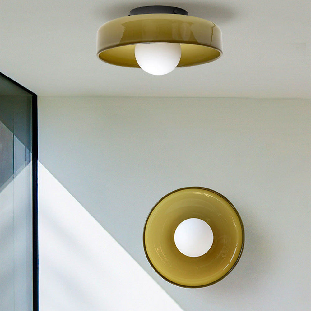 Modern olive green glass semi-flush mount ceiling light with a central opal globe