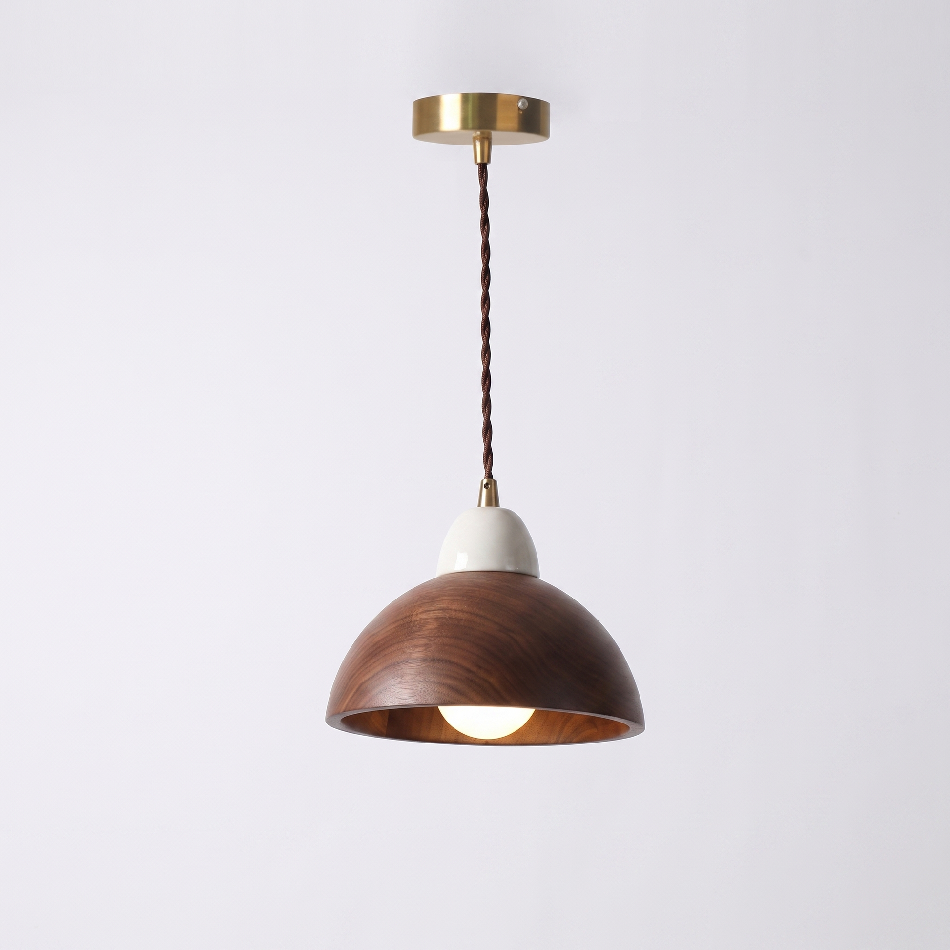 Oqzi minimalist wood and ceramic pendant light, Walnut Wood Dome style, hero shot on grey background