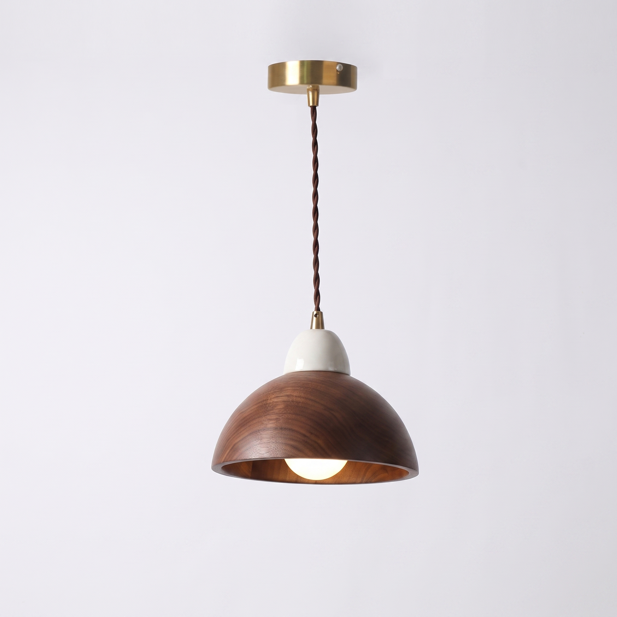 Oqzi minimalist wood and ceramic pendant light, Walnut Wood Dome style, hero shot on grey background