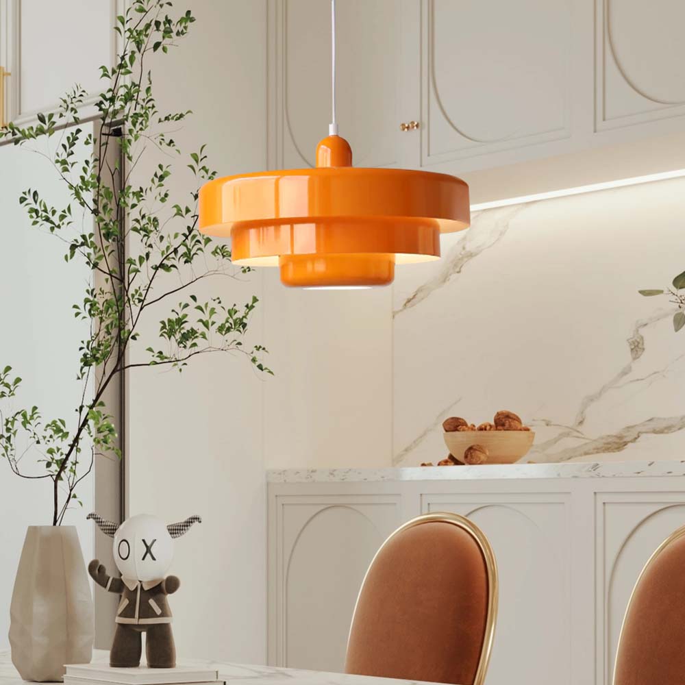Modern orange layered ceiling lamp providing ambient lighting in a contemporary kitchen setting