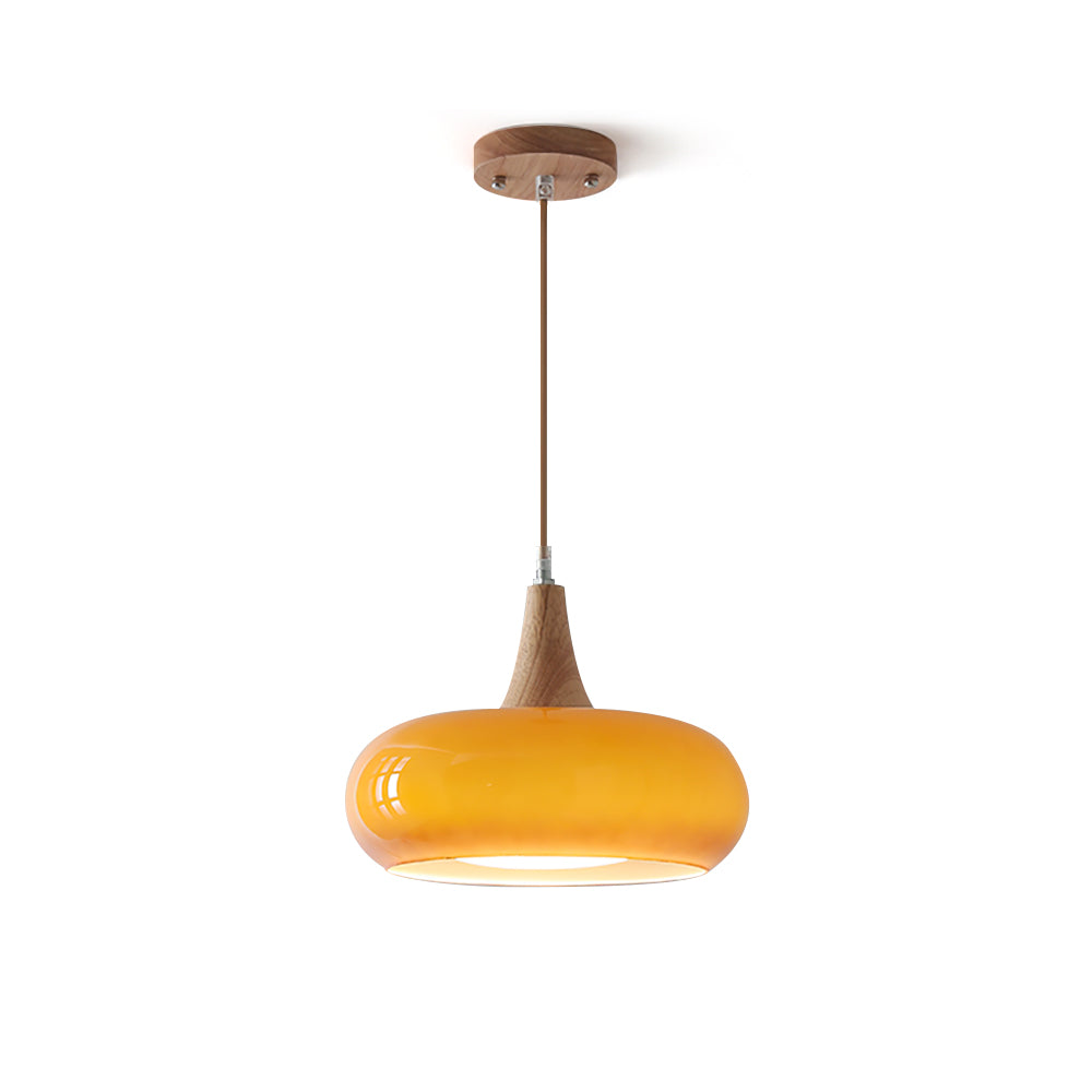 Isolated view of the vibrant orange mid-century glass pendant light with wood accent