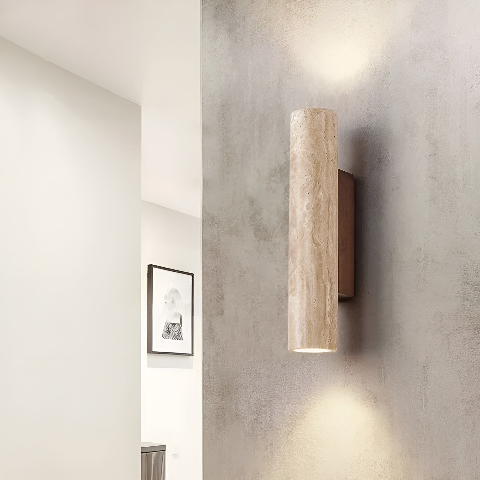 Organic stone wall sconce acting as a beautiful architectural accent on a textured hallway wall