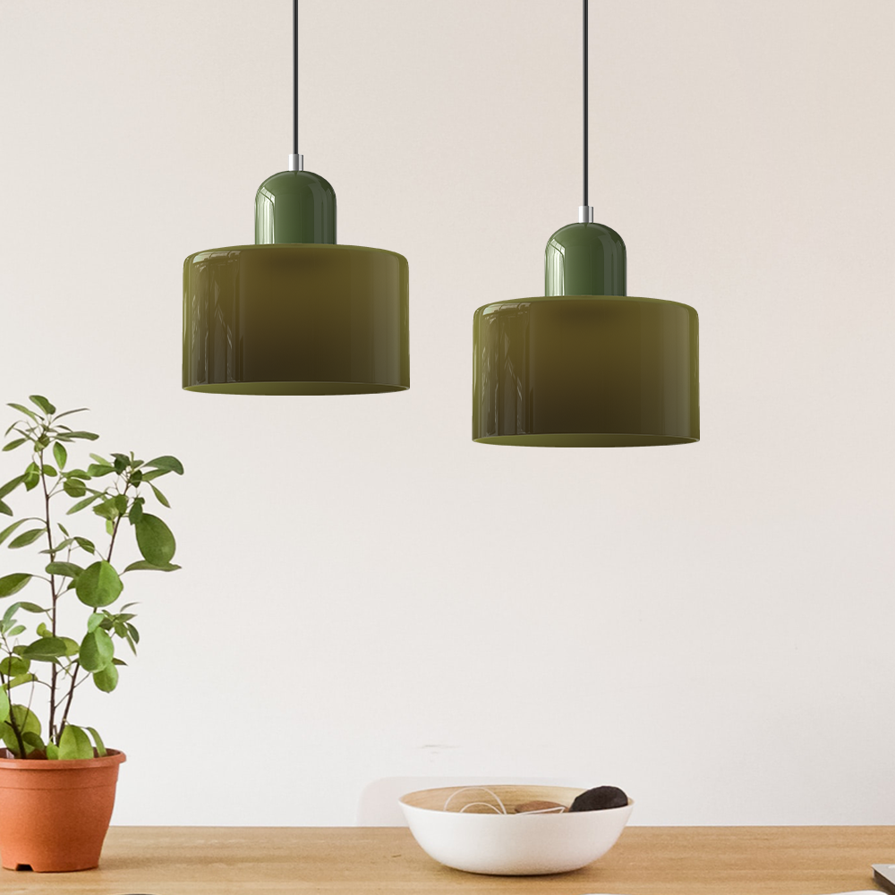 Pair of green Bauhaus glass pendant lights with warm ambient illumination