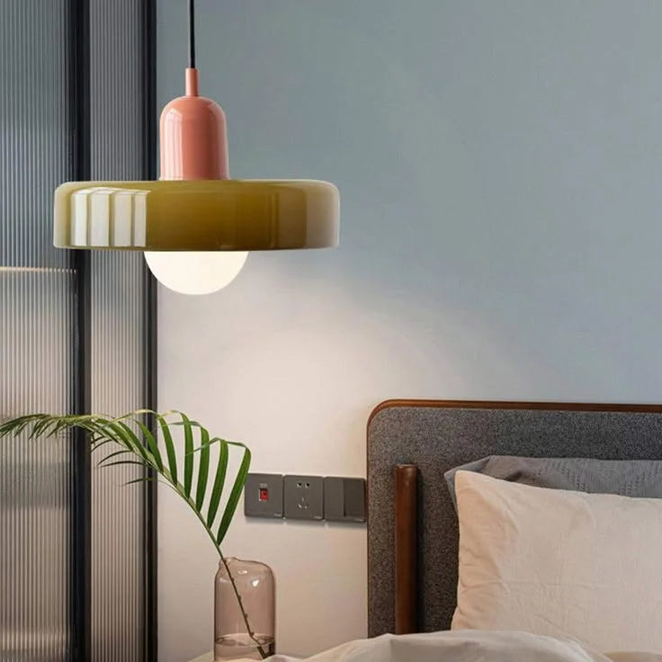 Pink and green colour-block pendant lamp styled as an elegant, space-saving bedside reading light