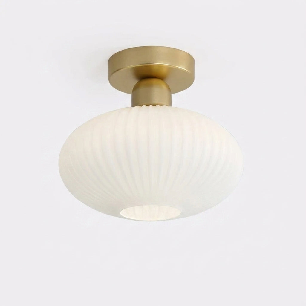 Qavlu ceiling light in oval shape with brushed gold fitting, on white background