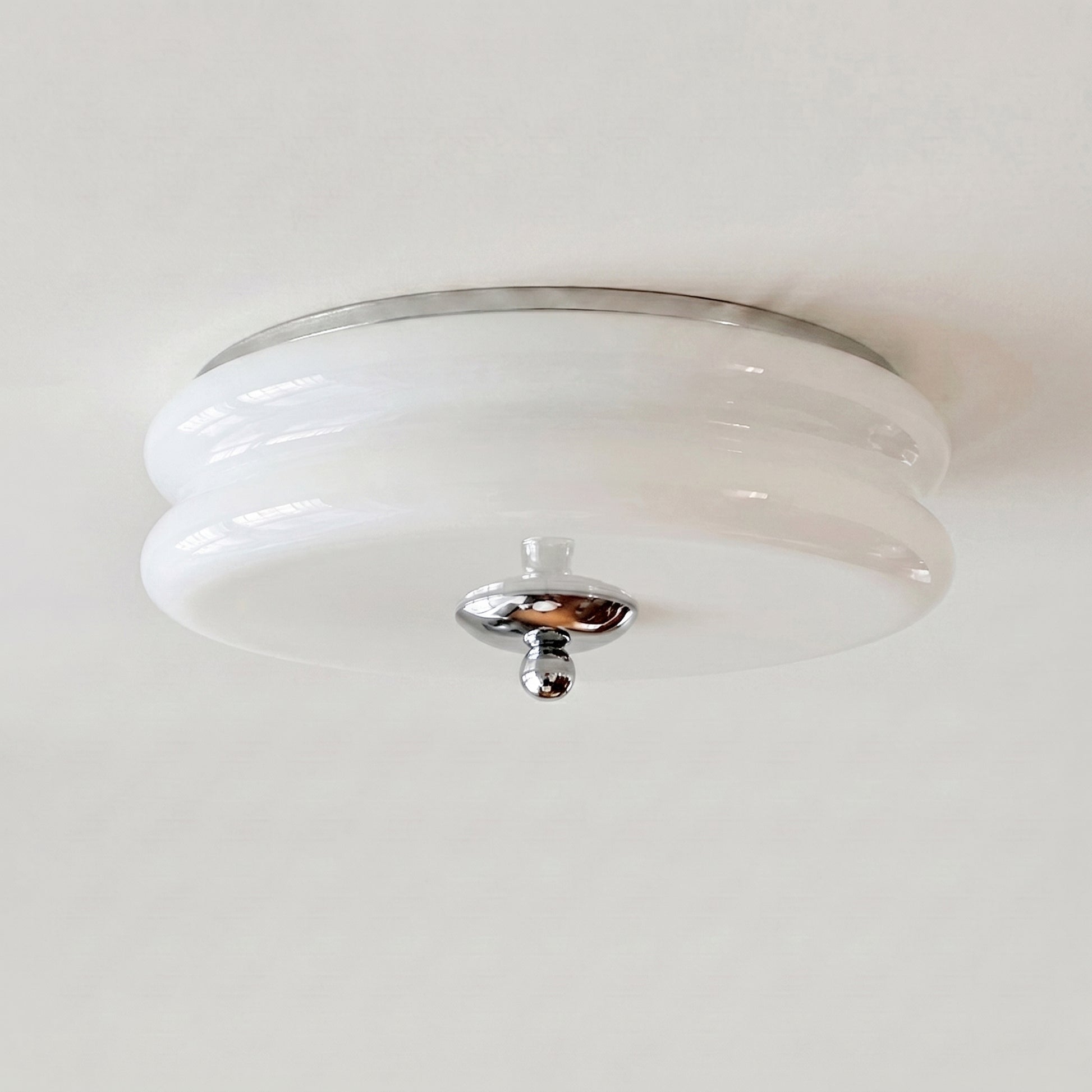 A semi-flush mount qoxli ceiling light fixture with a white ribbed glass shade and polished chrome hardware, shown installed on a white ceiling.