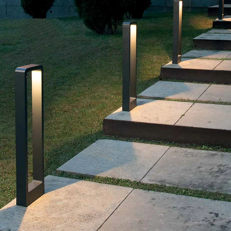 qura minimalist outdoor LED bollard lights providing safe, glare-free illumination for stone garden stairs