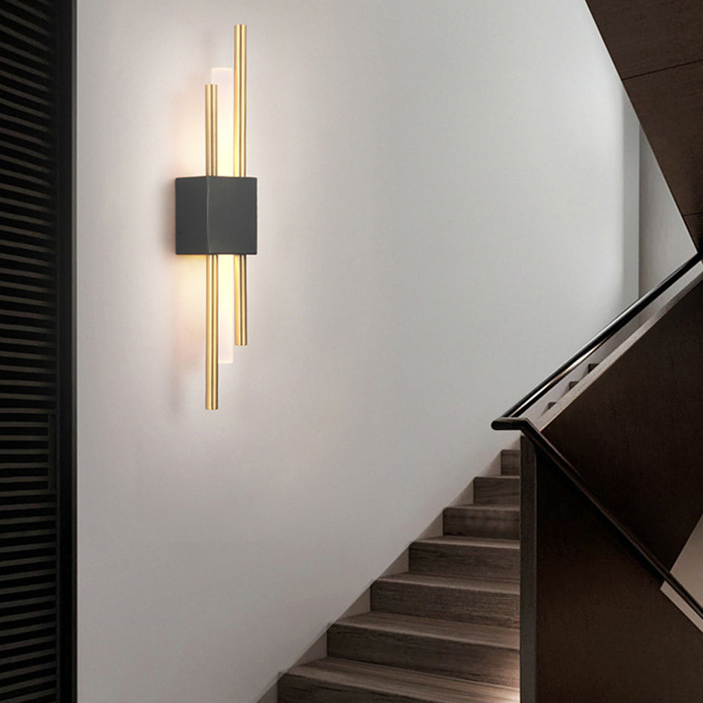 Black and gold qytu linear wall light acting as a modern architectural guide light on a contemporary staircase