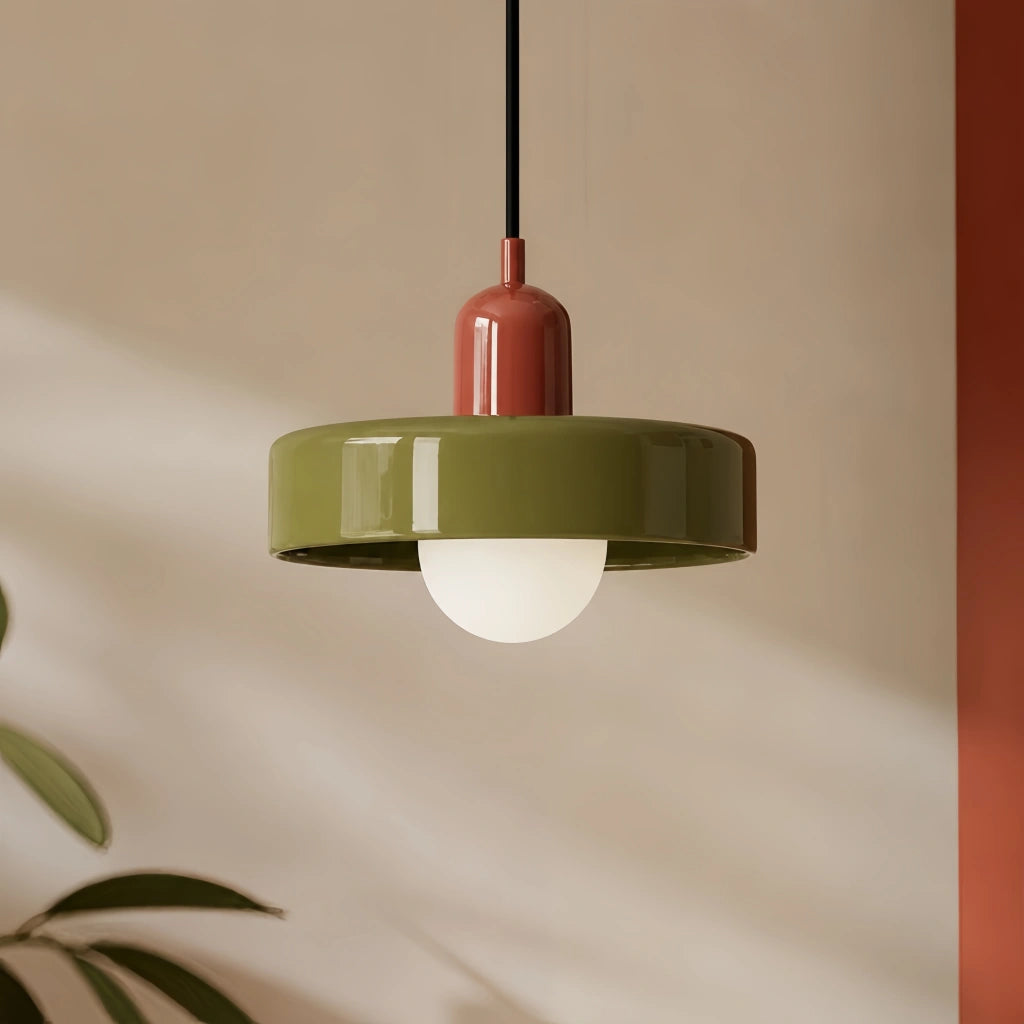 Red and green colour-block pendant light casting a warm, glare-free glow in a modern interior