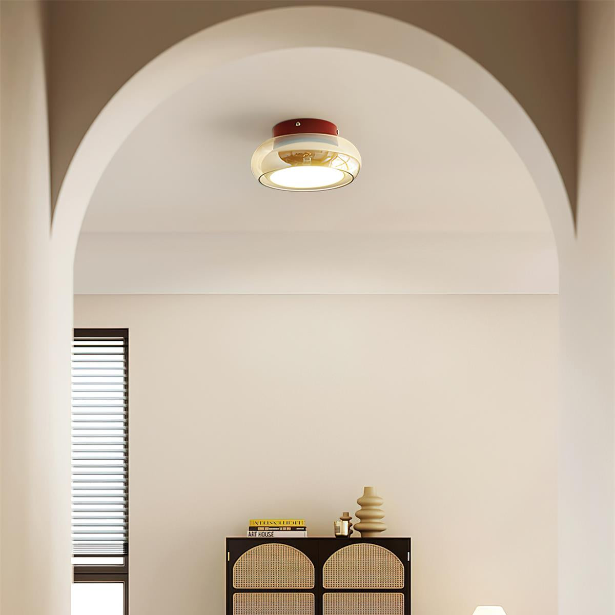 Retro amber ceiling light installed in a bright minimalist interior with an arched doorway