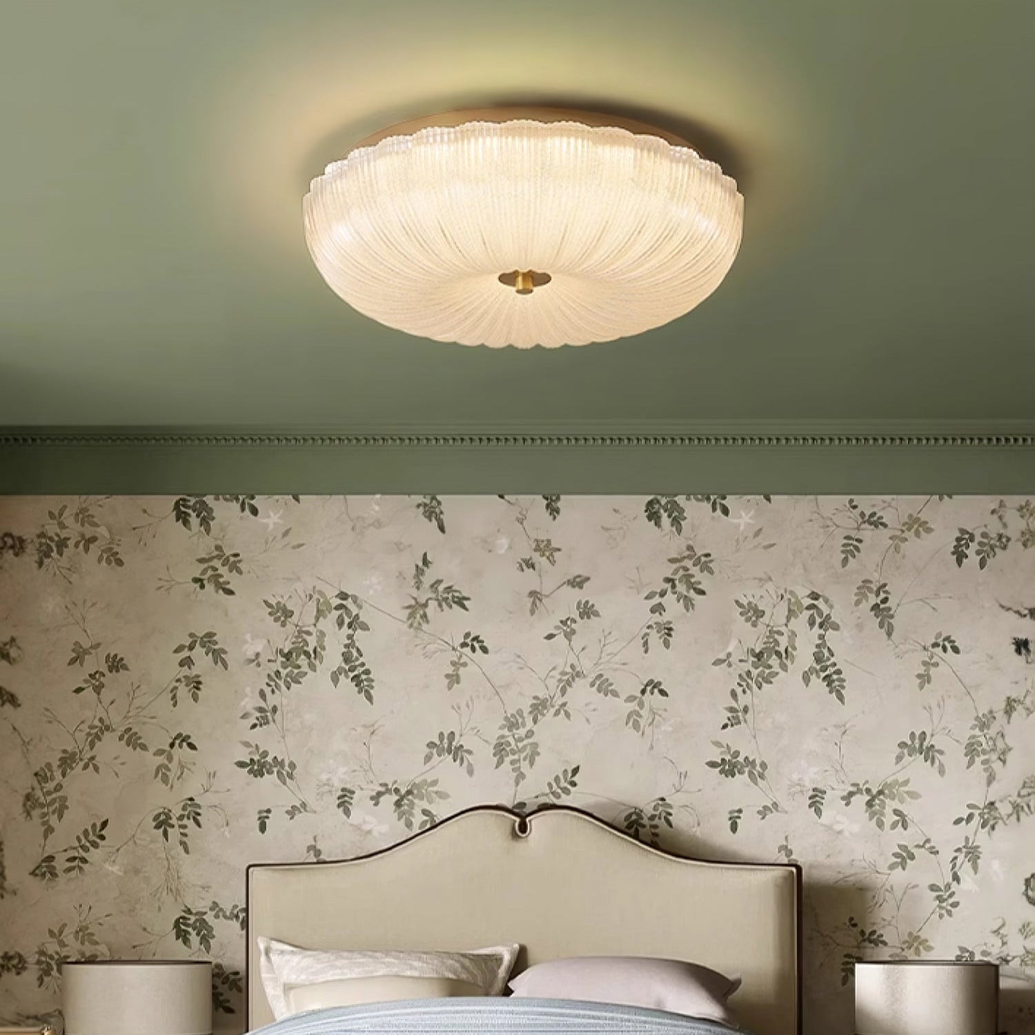 Ripple glass ceiling lamp contrasting beautifully against a green ceiling and floral wallpaper