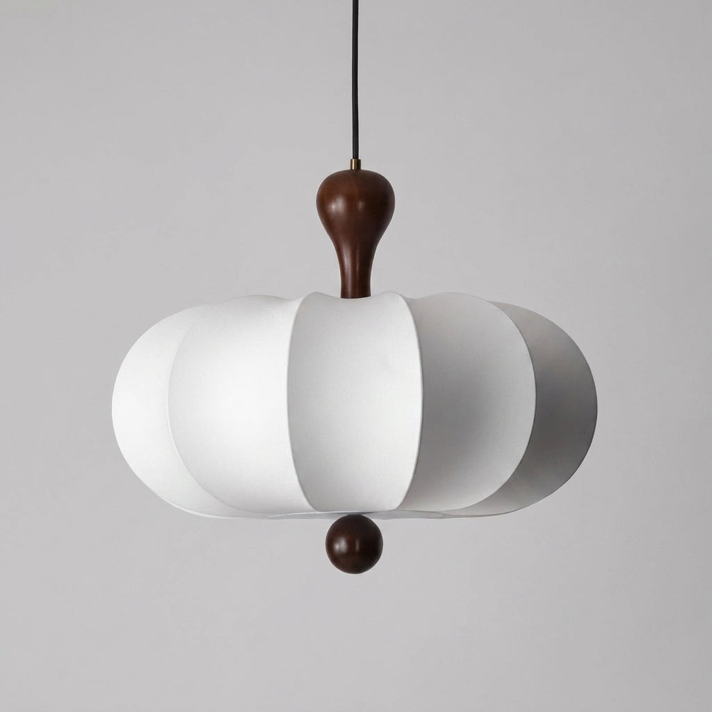 Rizqo sculpted fabric pendant light illuminated on a grey studio background