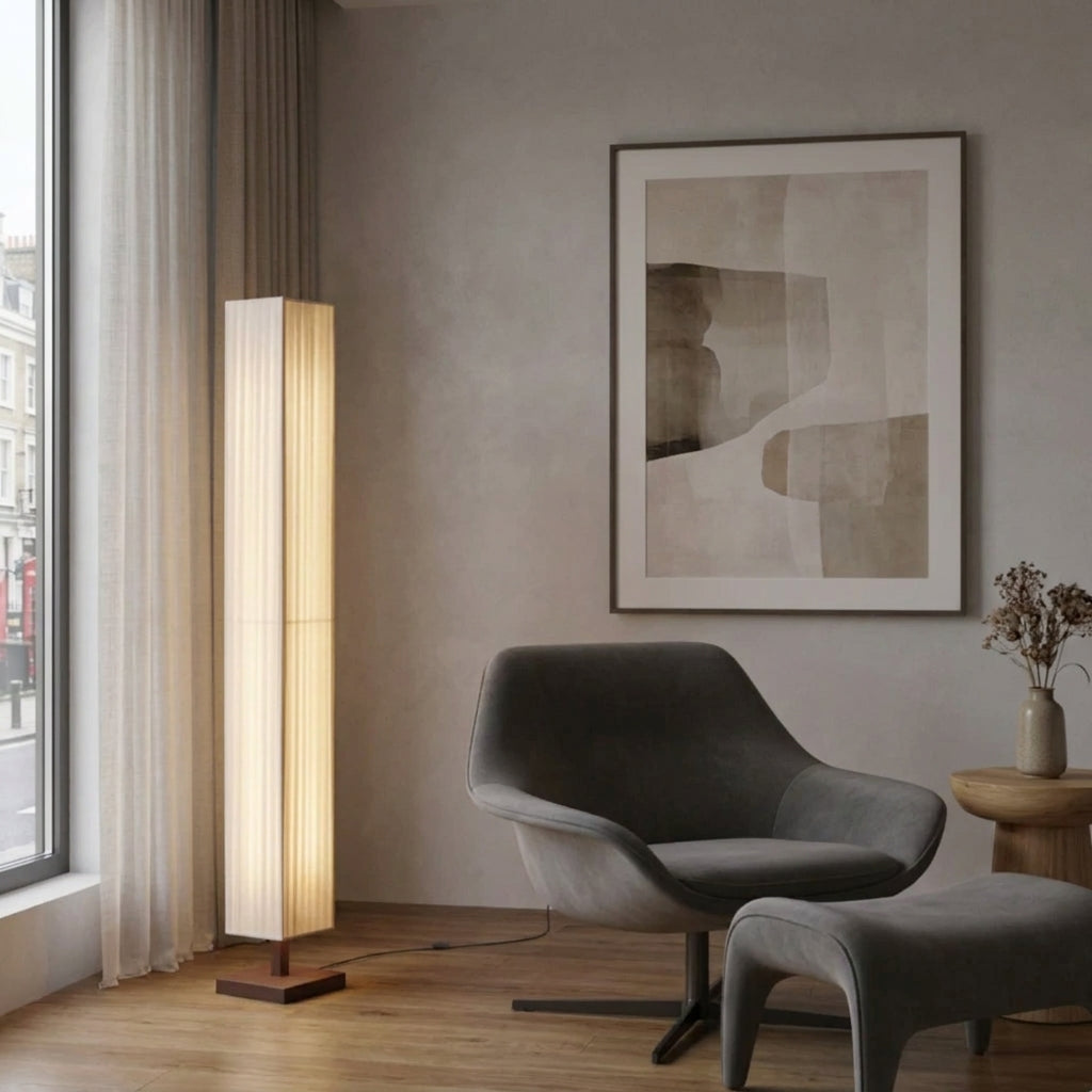 Ruxpa walnut floor lamp beside a curved grey chair near a curtained window