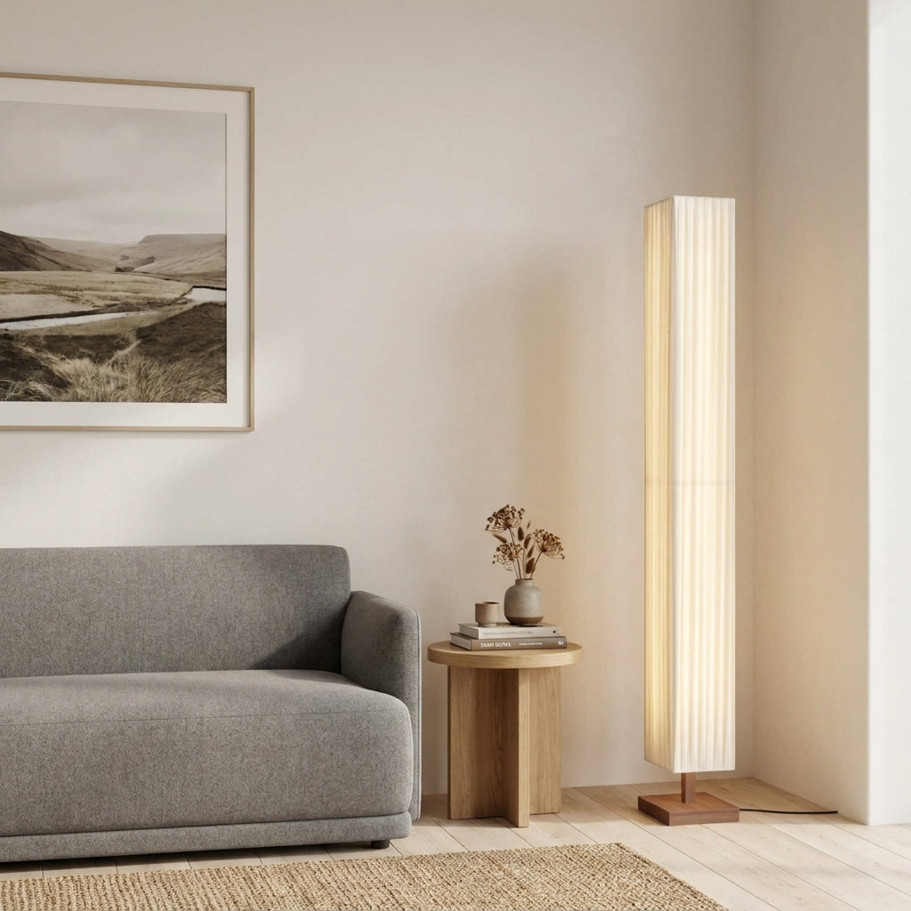 Ruxpa walnut floor lamp in a neutral-toned living room with a grey sofa and round wood side table