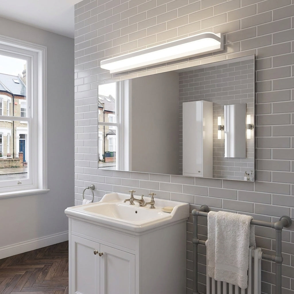 Rymza LED mirror light installed above a bathroom vanity