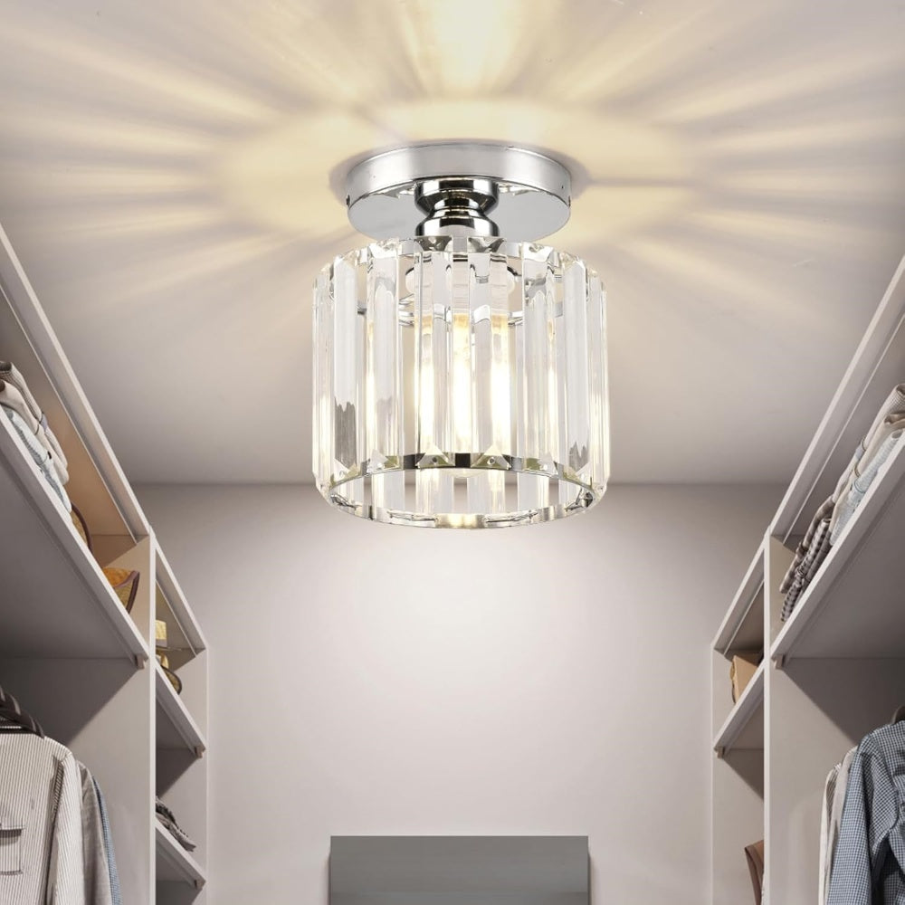 Silver round crystal mini chandelier providing bright light in a modern walk-in wardrobe
