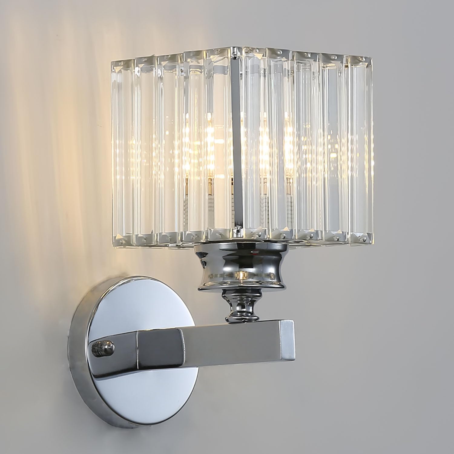 Sleek silver square crystal wall light isolated against a neutral grey background