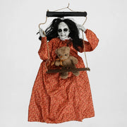 Skulke swinging ghost doll on its wooden swing, alternate studio view, on a plain studio background